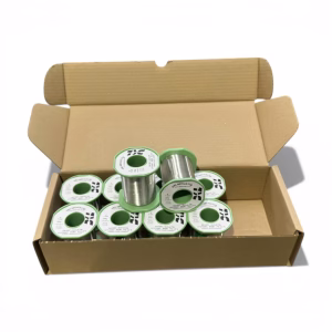 A box of 10 SN100C LF3135NC Cored Solder Wire 1mm reels meeting J-STD-004 RoM1 standards for professional electronics.