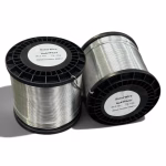Two 4kg reels of E-Qual Sn63Pb37 leaded solid solder wire, 2mm diameter, on DIN K125 plastic spools for automated selective soldering.
