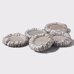 five round colbalt cathode pieces on a white background