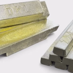 DKL Metals custom Babbitt white metal bearing alloy ingots stacked beside a bundle of 1kg industrial solder bars.