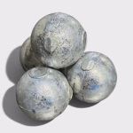 High Grade Cadmium sitting in a pile, in the form of 50mm anode balls